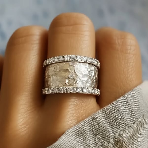 Silver ring encircled by two diamond bands